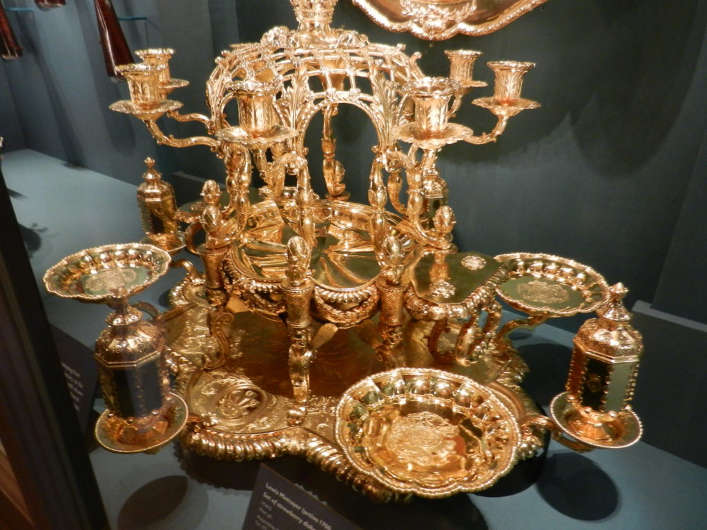 A gold épergne to enhance the dining table. Buckingham Palace is a place where all that glitters actually IS gold!